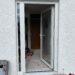 New glazed door and sidelights after window-to-door conversion in Cornwall